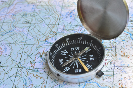 Correct navigation is the key to success. The magnetic compass lies on a topographic map.