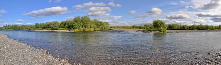 Panoramic river landscape in the polar Urals. Summer in the Russian North is short and beautiful.