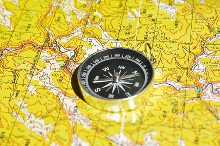 Symbols of travel - map with compass. Navigation tools for planning and guidance.