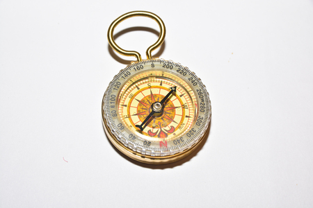 Compass on white. Navigation device and nothing more.の写真素材