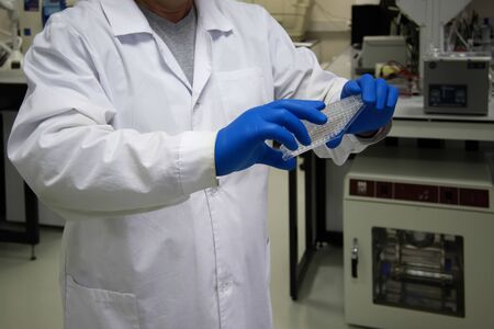 In the chemical-biological laboratory. Researcher in the workplace.