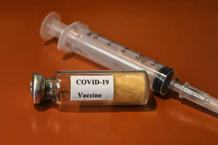 Vaccination against coronavirus COVID-19. A vial with a dry vaccine against SARS-CoV-2 infection.