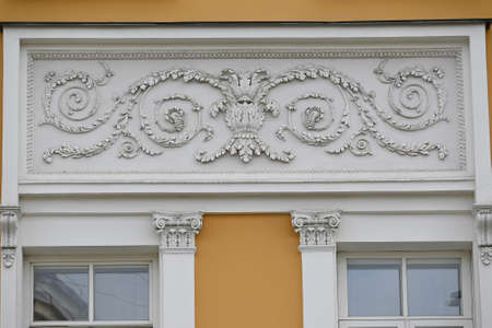 Decorative elements of the facade. Details of the exterior walls of houses on old Moscow streets.