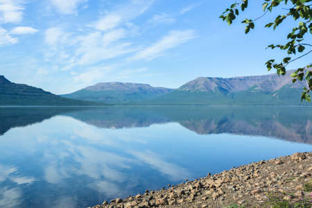 A mountain lake on the Putorana plateau. Water landscape in the region of active tourism in Russia.の写真素材