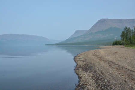 Putorana Plateau. Fog on a mountain lake. Water landscape in a foggy haze.の写真素材