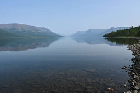 Putorana Plateau. Fog on a mountain lake. Water landscape in a foggy haze.の写真素材