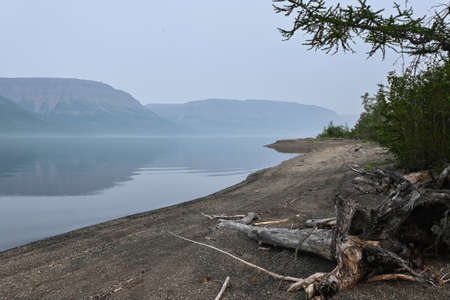 A mountain lake on the Putorana plateau. Water landscape in the region of active tourism in Russia.の写真素材