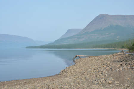 Putorana Plateau. Fog on a mountain lake. Water landscape in a foggy haze.の写真素材