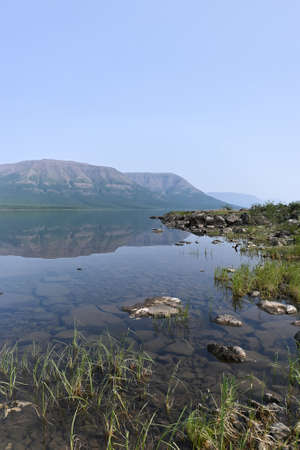 Putorana Plateau, a misty haze over the lake. Summer lake landscape in Eastern Siberia.の写真素材
