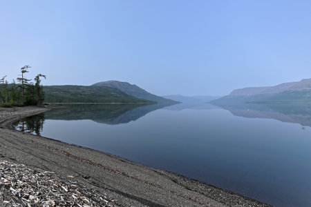 Putorana Plateau, a misty haze over the lake. Summer lake landscape in Eastern Siberia.の写真素材