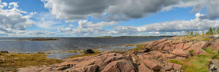Panorama of the White Sea coast. Summer panoramic landscape of the sea coast in Karelia.の写真素材