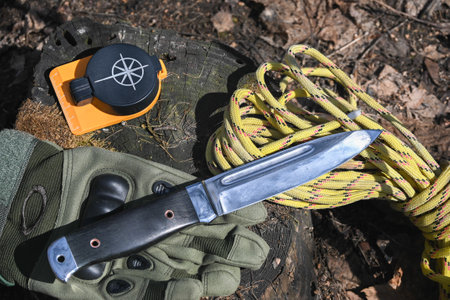 bushcraft equipment. Knife and rope lit by the sun.の写真素材
