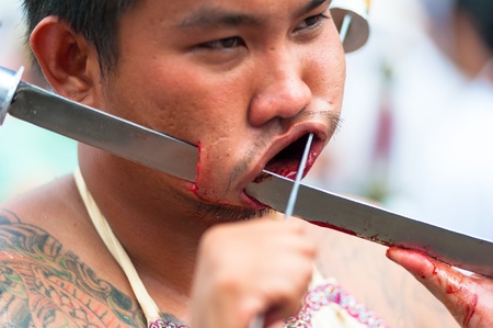 PHUKET, THAILAND- OCT 23: Unidentified participant the parade on October 23, 2012 Vegetarian Festival Phuket Thailand. The Festival is a famous annual festival also known as Nine Emperor Gods festivalのeditorial素材