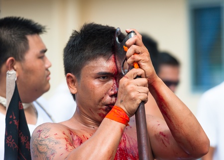 PHUKET, THAILAND- OCT 23: Unidentified participant the parade on October 23, 2012 Vegetarian Festival Phuket Thailand. The Festival is a famous annual festival also known as Nine Emperor Gods festivalのeditorial素材