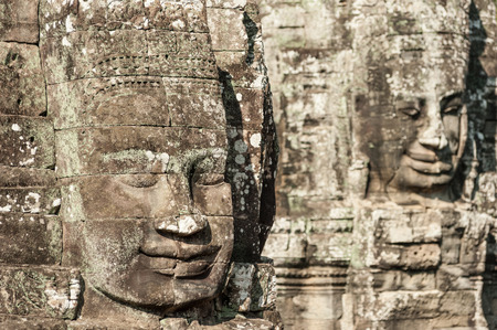 Angkor Wat Cambodia  Bayon temple in Angkor Thom historical place  Human face and figures murals and...