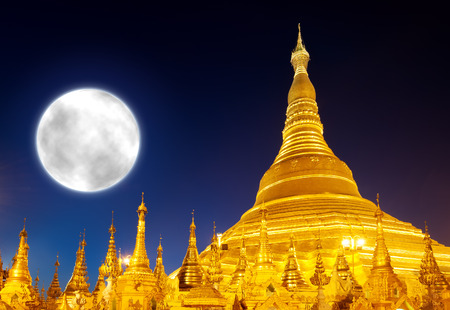 Shwedagon Pagoda and big moon in Yangon, Myanmar (Burma)の写真素材