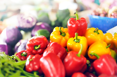 Red and yellow organic sweet peppers on vegetables market of Thailand