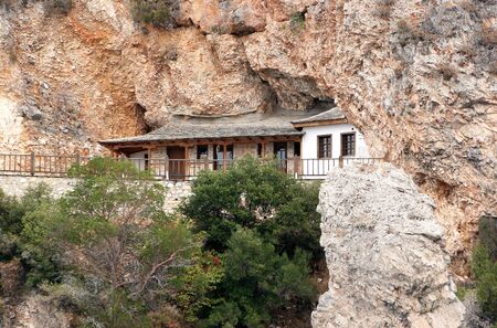The monastic hermitage located in a cave Athos Mountains. Greeceの写真素材