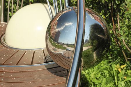 Reflections of the city in a metal ball. Modern Architectureの写真素材