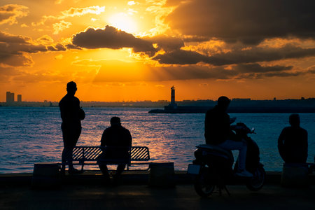 Istanbul, Turkey - September 2022: People watching the sunset. Sunset in Istanbul Kadikoy.の写真素材