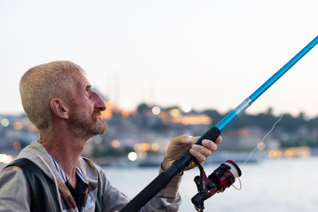 Fishermen at the Galata Bridge, Fisherman fishing in Istanbul on June 28. 2018 in Turkeyのeditorial素材