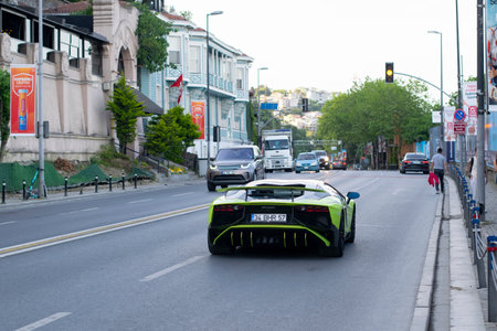 Istanbul, Turkey - May 24, 2022: Background image of green super car Lamborghini Aventador on the city street.のeditorial素材