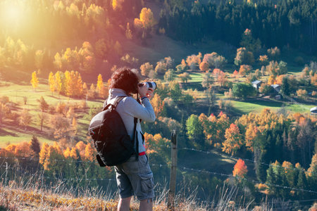 Young man traveler looking and photographing beautiful autumn in Turkey, Travel lifestyle concept.