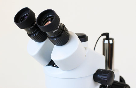 trinocular stereo zoom microscope on white background