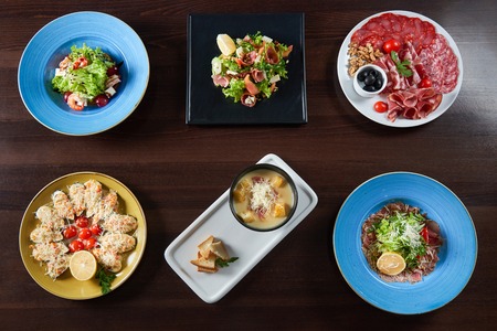 Eatable perfection. Top view of a variety of tasty dishes served at the restaurantの写真素材