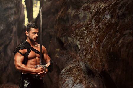 Manly warrior at the mountains