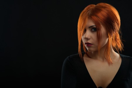 Beautiful redhead woman in studio