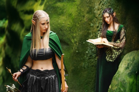 Two female elves walking in the woodsの写真素材