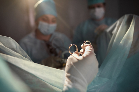 Team of surgeons performing operationの写真素材