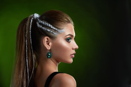 Beautiful female with stylish hairstyle and makeup  after beauty salon.の写真素材