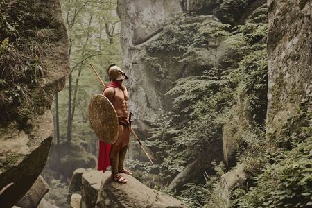 Muscular warrior in gladiator armorの写真素材