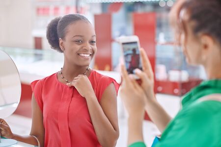 Female friends at the jewelry storeの写真素材
