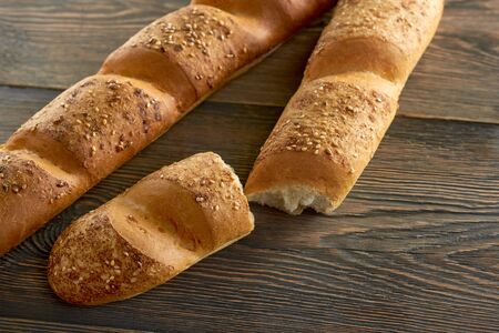 Fresh bread on wooden worktop