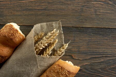 Fresh bread on wooden worktop