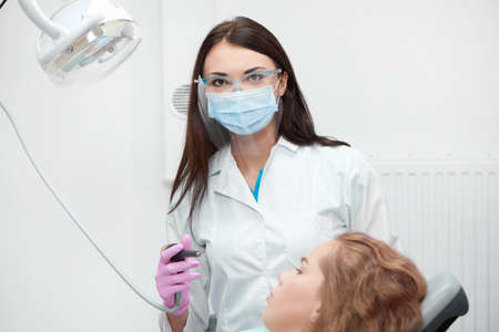 Professional female dentist at workの写真素材