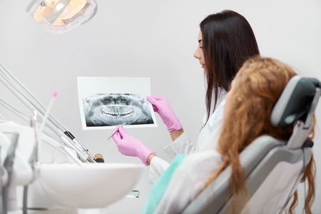 Professional female dentist at workの写真素材