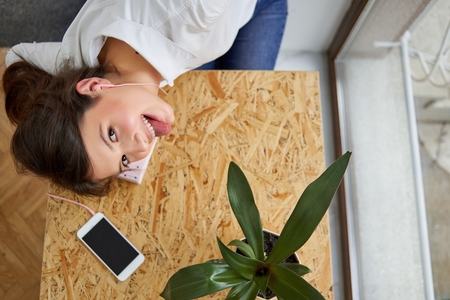Young female student at the libraryの写真素材