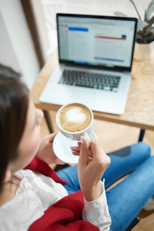 Young brunette at the cafeの写真素材