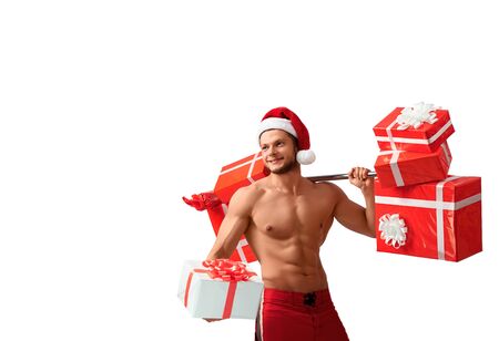 Ripped Santa Claus holding barbell and giving presentsの写真素材