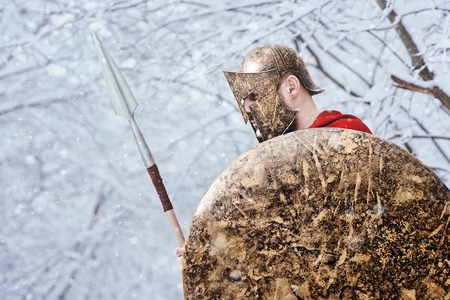 Alone spartan warrior keeps his armor in the forest.の写真素材