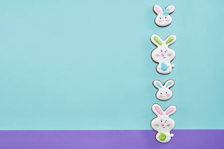 From above view of ginger glazed cookies isolated on blue and purple background. Homemade lovely...