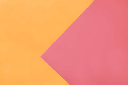 Modern backdrop with triangles overlay layers of pink and orange colors. Pastel shades background for text or print designの写真素材