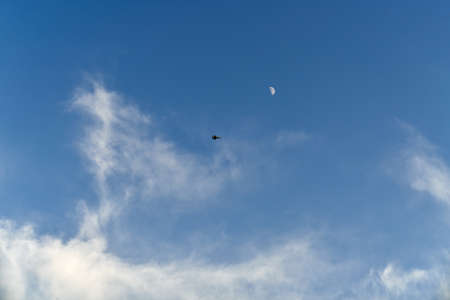 Beautiful blue sky with plane flying on distance. Natural background wallpaper. Calmness atmosphere...