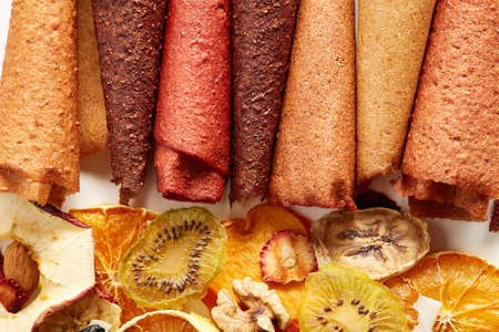 Above view of handmade fruit pastilles with apples and blackcurrants on white background.Concept of...