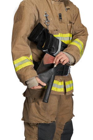 Anonymous male fireman pulling hammer from black leather holster. Crop view of firefighter in protective outfit, taking out fire tool for use, isolated on white studio background. Equipment concept.の写真素材