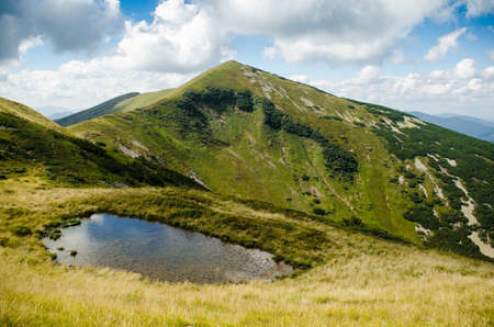 Summer mountain landscape with a lake in the foregroundの写真素材